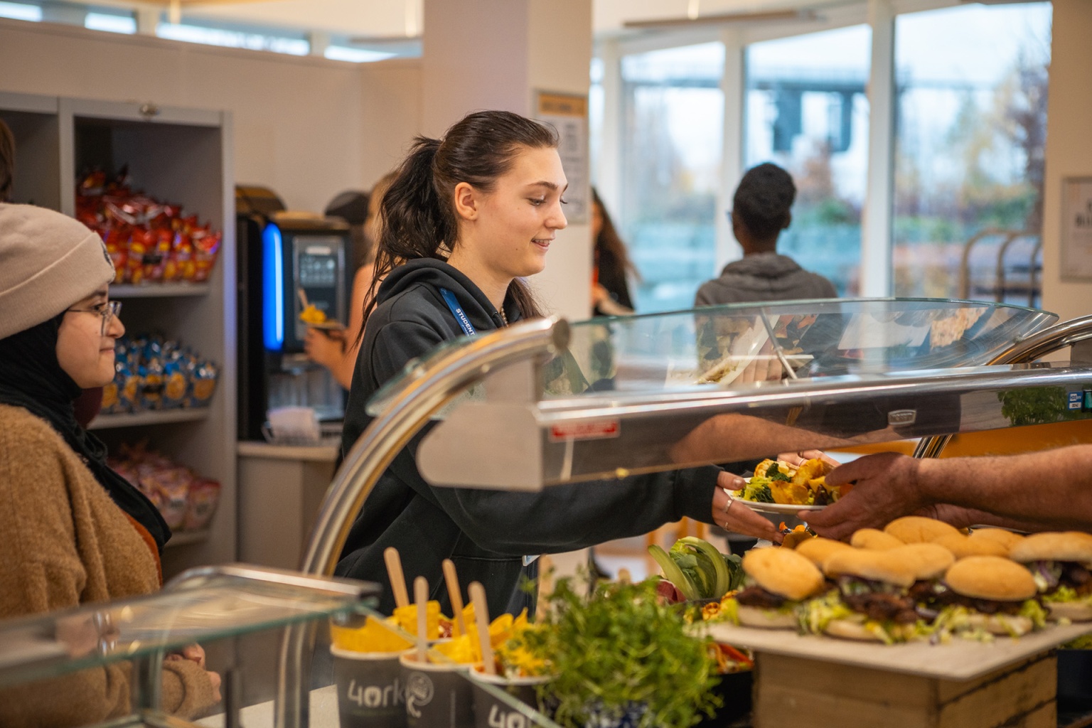 sixth form college students being served with mellors food