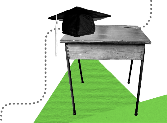 classroom desk with mortar board